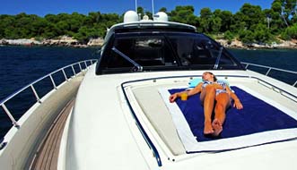 Woman relaxing on a luxurious Riva 68